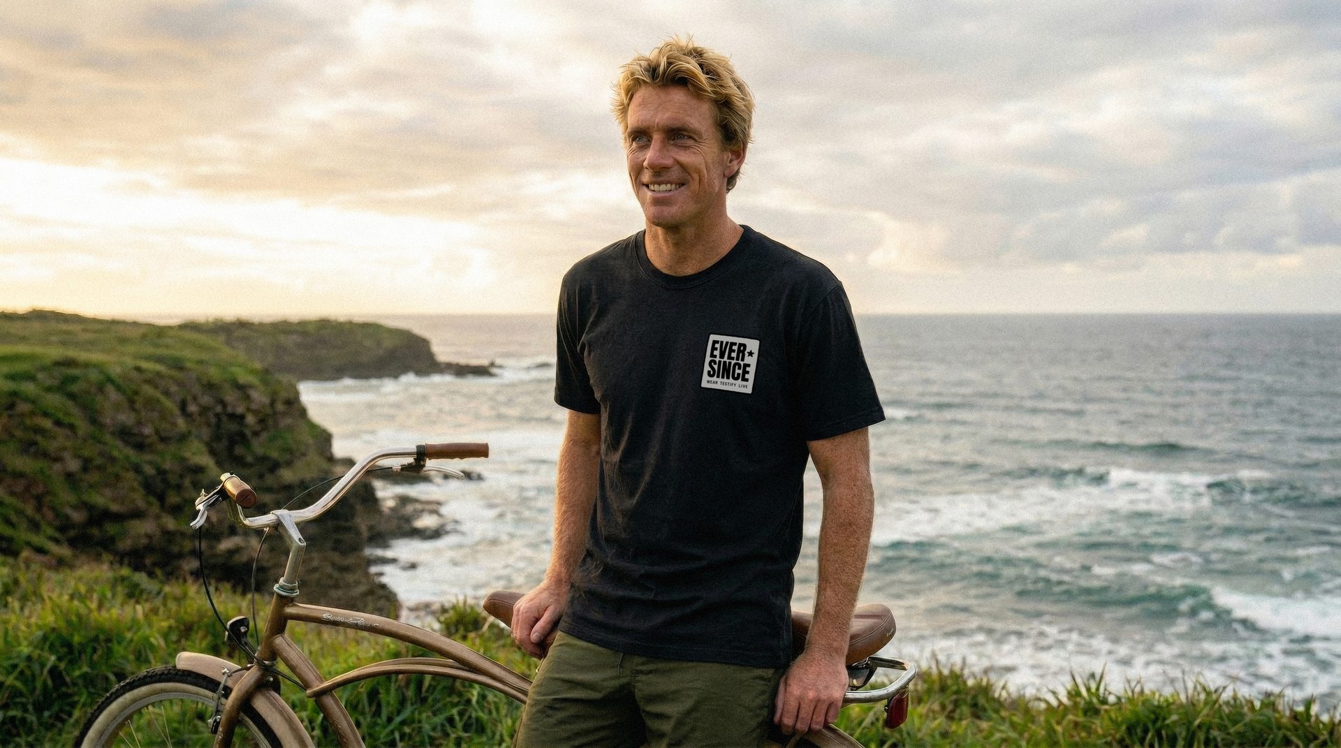 Wade with his bike wearing EverSince apparel — adventure and lifestyle